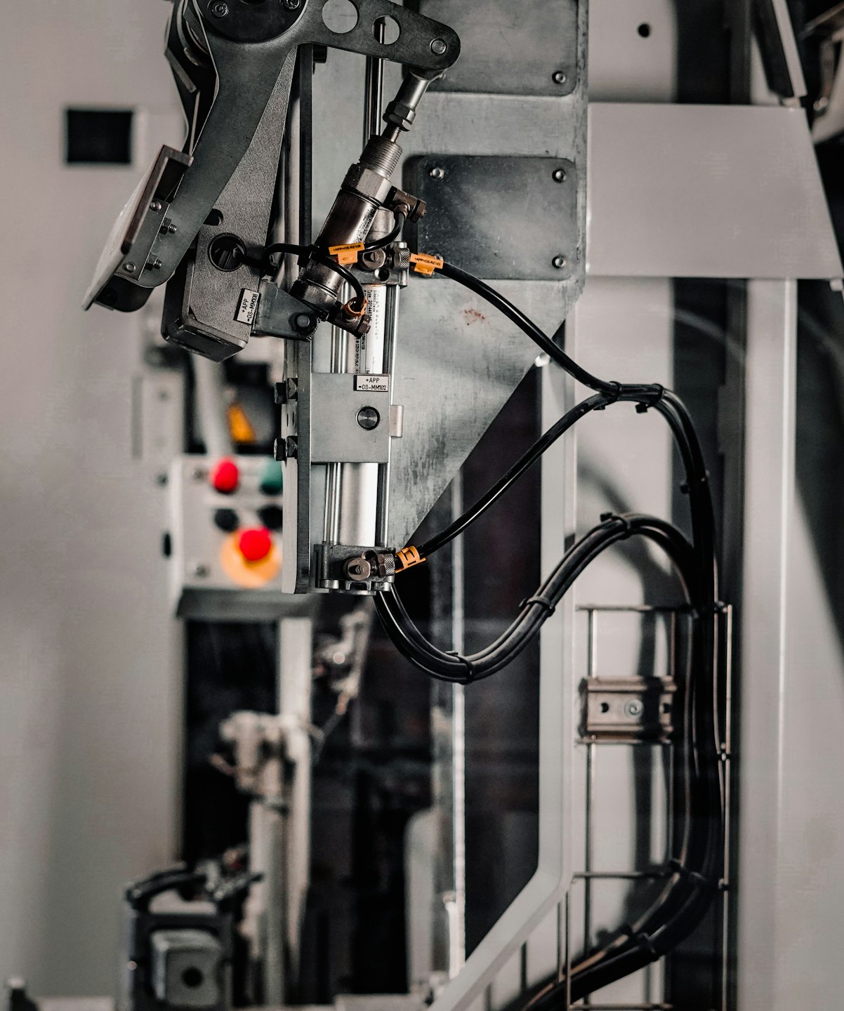 Close-up of industrial machinery with metal components and cables.